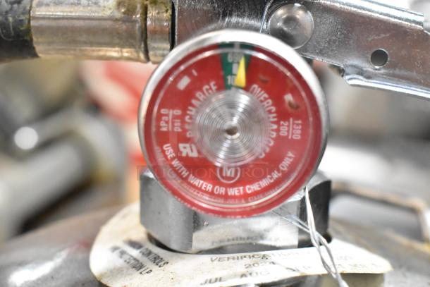 Close-up of a Kitchen One wet chemical fire extinguisher gauge, displaying pressure levels. Brand new with tags.