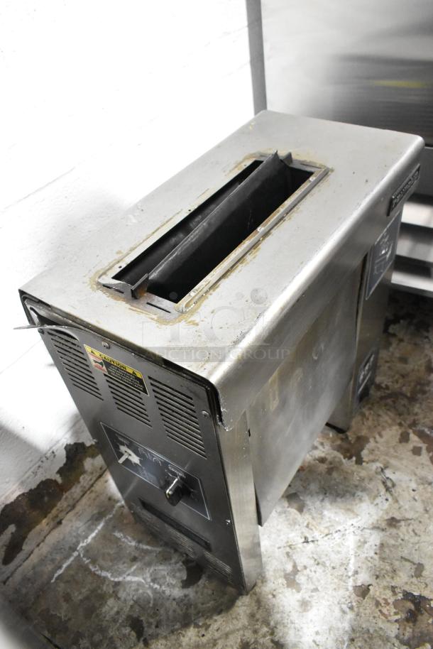 Roundup VCT-2000CS stainless steel vertical contact toaster, 208V, 1 phase, used condition, clear caution label visible.