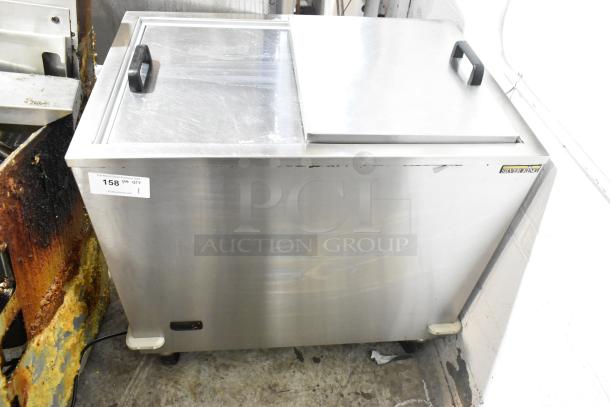 Silver King stainless steel commercial chest freezer with casters, 115 volts, single phase, visible wear, label intact.