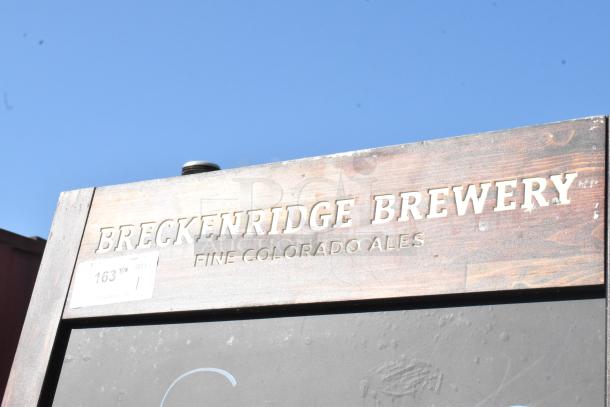 Wood pattern A-frame sidewalk sign with "Breckenridge Brewery" and "Fine Colorado Ales" text. Slightly weathered condition.