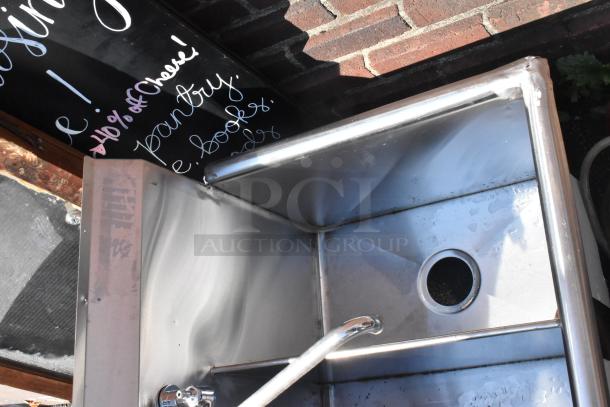Stainless steel 3 bay sink with faucet and handles, in good condition, ideal for commercial use.