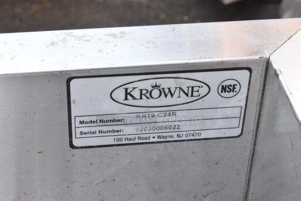 Krowne KR19-C24R stainless steel drain board, model tag visible with serial number 02030006022, NSF certified, slight surface wear.