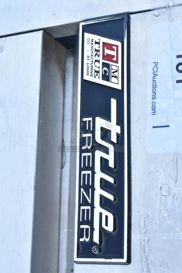 True T-49F Stainless Steel Commercial Freezer badge, model label visible, showing brand and manufacturing details.