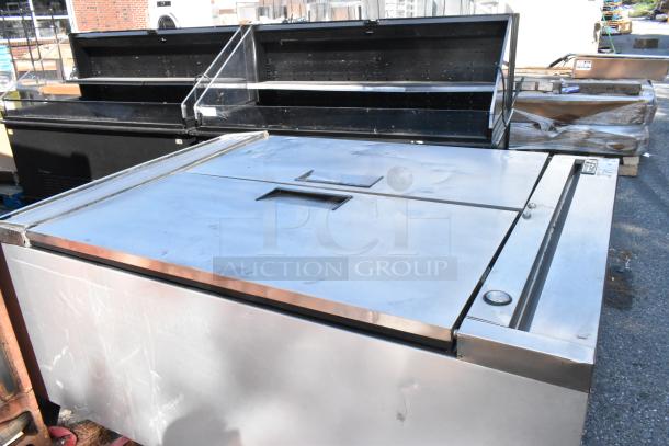 True T-49F stainless steel freezer with two doors, poly-coated racks, 115 volts, in used condition.
