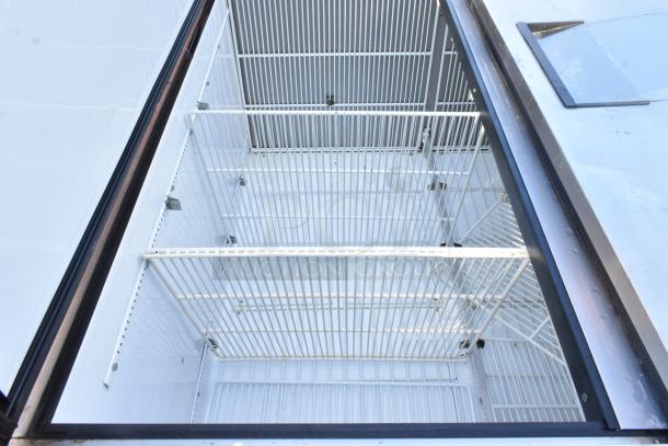 True T-49F stainless steel commercial freezer, two-door, with poly-coated racks, 115V, 1 phase, interior view.