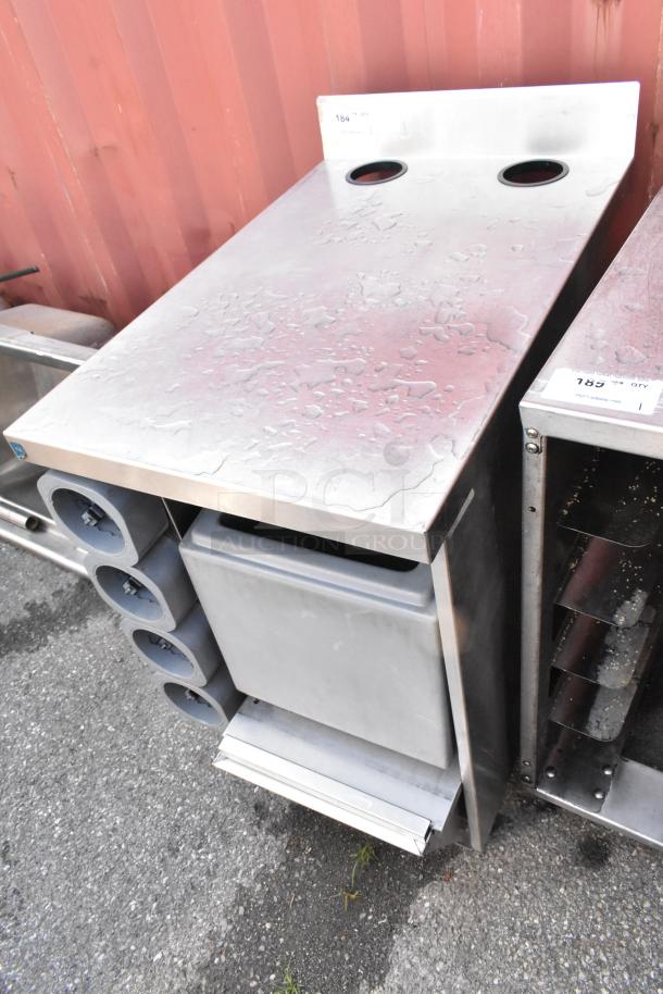 Stainless steel counter with four built-in cup dispensers, features a sleek design, durable construction, and good condition.