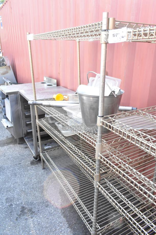 Chrome finish 4-tier wire shelving unit with contents. Buyer must dismantle. Consider freight charges.