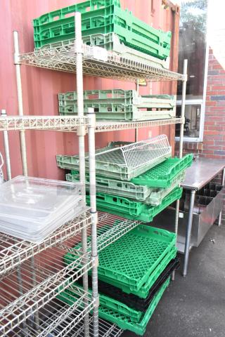 Chrome finish 4-tier wire shelving unit with assorted trays. Good condition. Buyer responsible for dismantling.