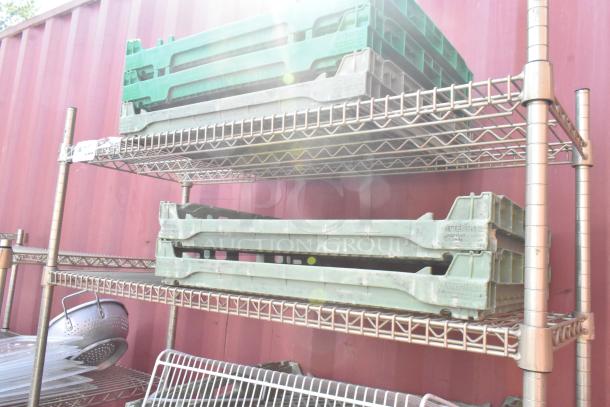 Chrome finish 4-tier wire shelving unit with assorted contents, featuring green crates. Good condition. Buyer must dismantle.