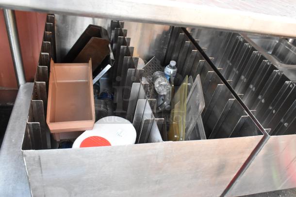 Stainless steel table with under shelf and two pan racks. Features include durable construction and ample storage. Good condition.