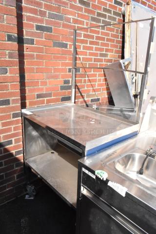 Stainless steel cart with under shelf, commercial casters, solid build, good condition, ideal for kitchen use.