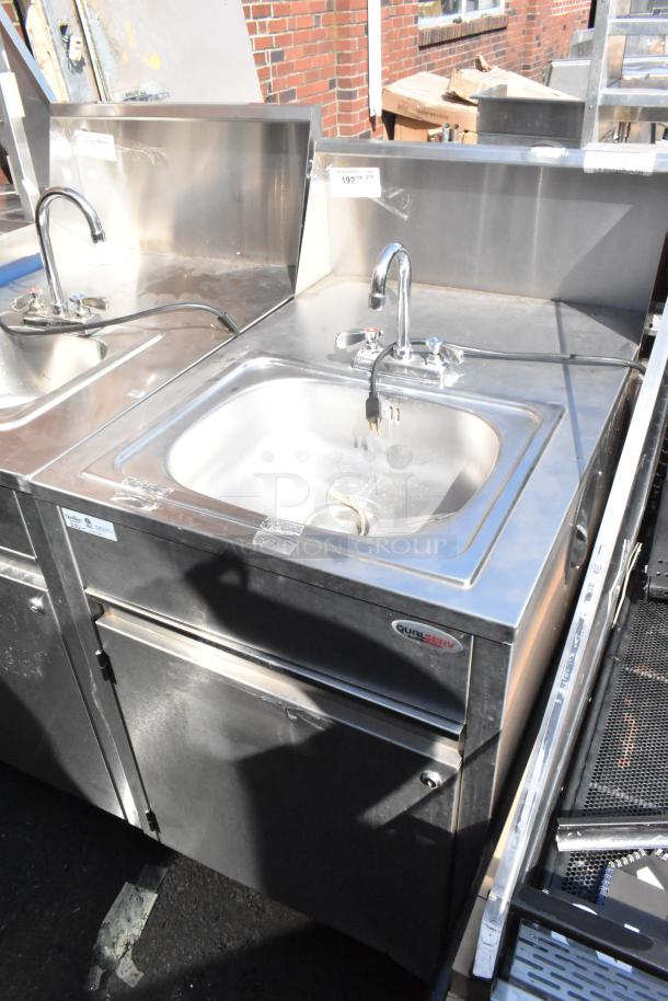 QualServ WMSC24MS stainless steel portable sink on casters, commercial grade, faucet and storage, slight tarnish visible.