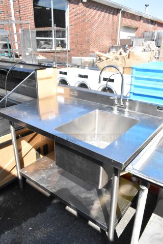 Griffin stainless steel table with single sink bay, faucet, handles, and lower shelf. Good condition.