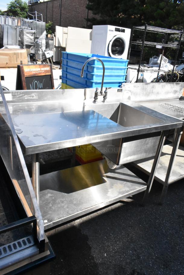 Griffin stainless steel table with single sink bay, faucet, handles, and under shelf; features durable construction.