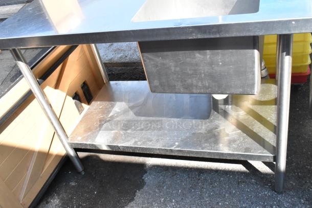 Griffin stainless steel table with single sink bay, faucet, handles, and under shelf, in good condition.