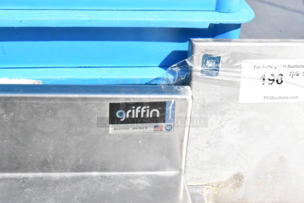 Griffin stainless steel table with single sink bay, faucet, handles, under shelf, and NSF certification label visible.