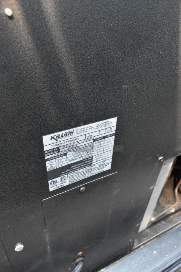 Killion PFW-74-43-56-V-N-MOBILE merchandiser, label showing model, voltage (208/230V), and specs. Black metal surface.