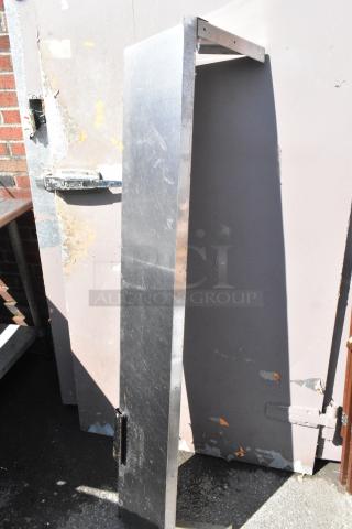 Stainless steel shelf in good condition with visible light scratches, ideal for industrial or home use.