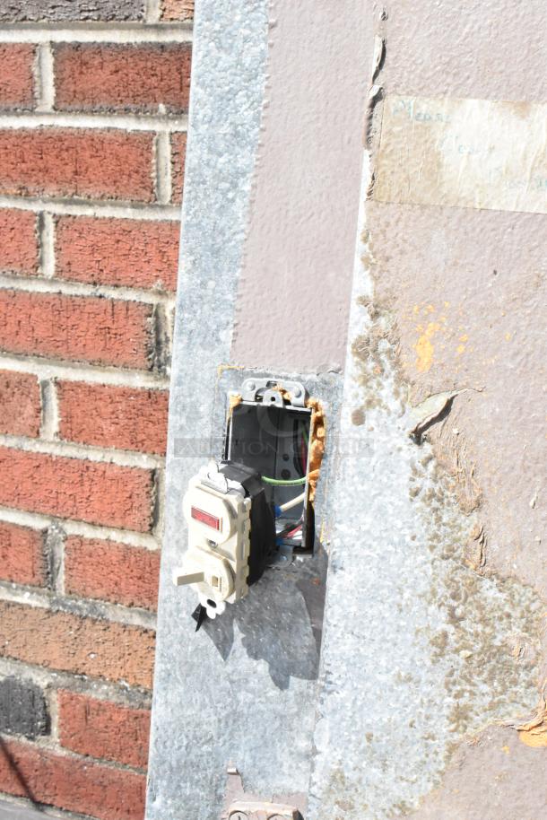 Storflex Walk In Box Door with frame, showing exposed wiring and electrical switch, signs of rust and wear.