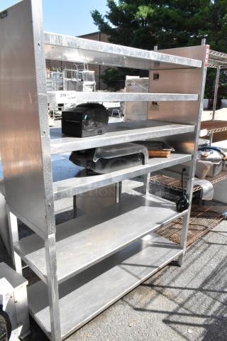 Metal 6 tier shelving unit with silver finish, minor wear. Sturdy construction, suitable for storage or display.