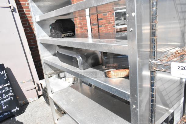 Metal 6-tier shelving unit with sturdy construction, visible signs of wear, and numbered auction tag. Ideal for storage.