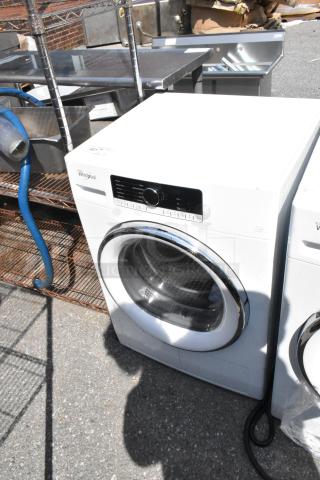 Whirlpool front load dryer, white metal finish, control panel with various settings, standard drum, well-maintained condition.