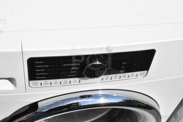 Whirlpool metal front load dryer with digital controls, multiple drying settings, and chrome door. Model in excellent condition.