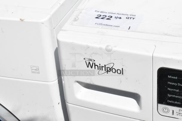 Whirlpool metal front load dryer, visible scratches, Energy Star certified, auction tag marked "222 7/10 QTY".