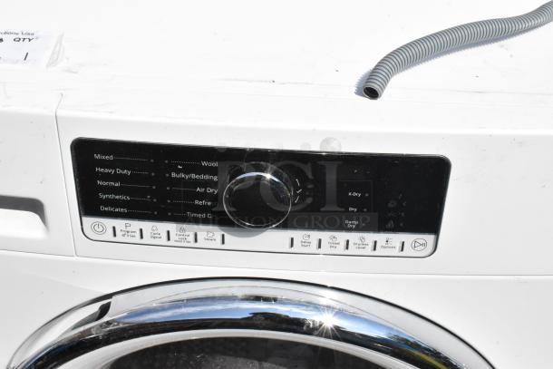 Whirlpool front load dryer with metal finish, visible settings panel, and chrome accents. Clean and well-maintained condition.