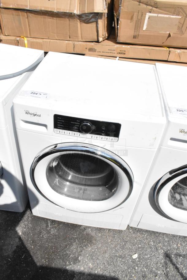 Whirlpool front load dryer, metal finish, excellent condition. Features digital control panel. Model tag visible on top.