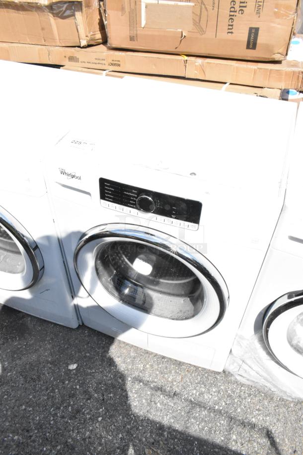 Whirlpool front load dryer, metal construction, digital controls. Good condition, visible brand logo. Perfect for modern laundry.