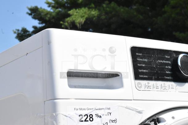 Whirlpool front load washer model WFW5090JW0, white, various cycle options visible, in good condition.