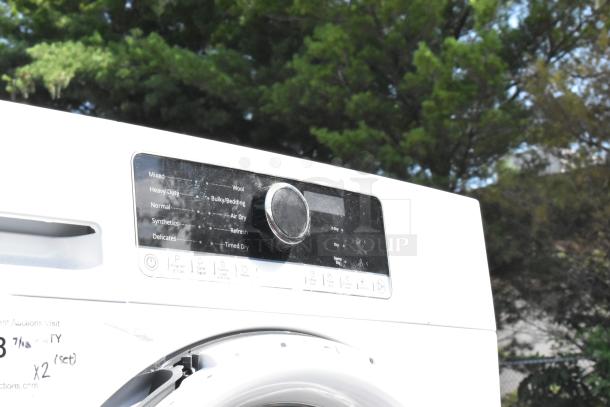 Whirlpool front load dryer and Whirlpool WFW5090JW0 washer with control panel and various settings visible.