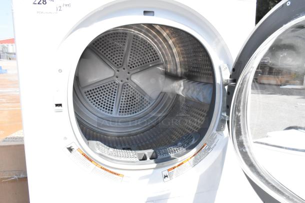 Whirlpool metal front load dryer, open door view showing inner drum, in excellent condition.