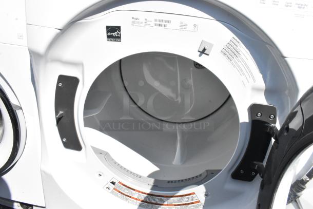 Whirlpool WHD560CHW1 front load washer, Energy Star certified, metal exterior, visible warning labels, unused condition.