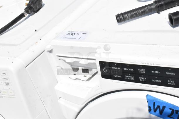 Whirlpool WFW5620HW2 Metal Front Load Washer, 120 Volts, 1 Phase. Visible control panel with multiple wash settings. Some wear shown.