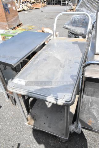Metal 2 Tier Cart with Commercial Casters, showing signs of wear, ideal for utility and storage tasks.