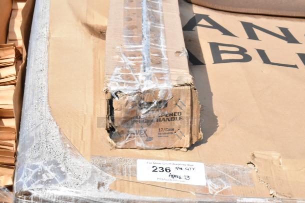 Packaging of new auction items including Lancaster table, Vollrath whisk, and Choice floor mat. Label shows 13 items.