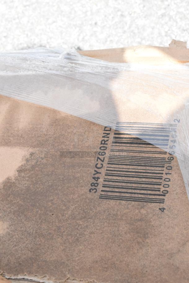 Torn packaging revealing barcode and label "384YCZ60RND" on a new auction item box.