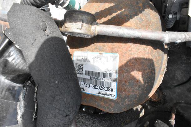 Rusty Copeland compressor among 19 available, showing serial label. Varied condition, bid multiplied by 19 for purchase.
