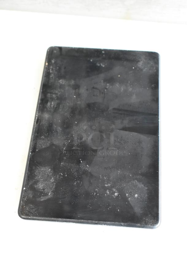 Five various tablets, including Lenovo TB-8505F, show visible signs of wear. No labels or markings. Auction lot.