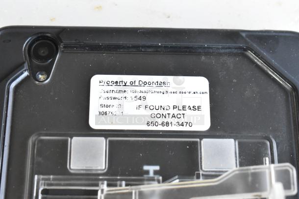 5 various tablets including Lenovo TB-8505F. Label states "Property of Doordash," includes contact info if found.