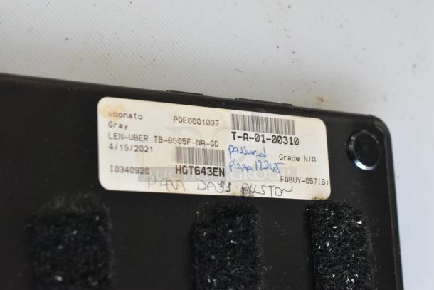 Label on the back of a Lenovo TB-8505F tablet showing product details and handwritten notes. Grade not applicable.