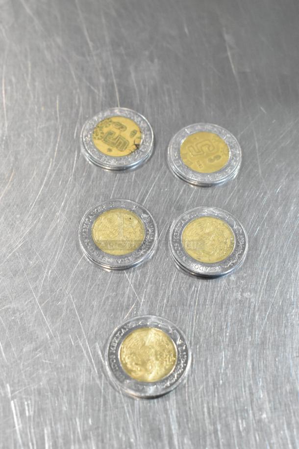 Lot of 10 various bimetallic coins on metallic surface, featuring diverse designs and inscriptions.