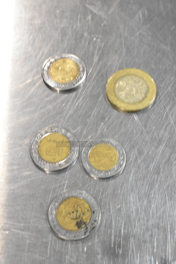 Lot of 10 various coins, mixed designs and sizes, placed on a reflective surface. Coins range from different countries.