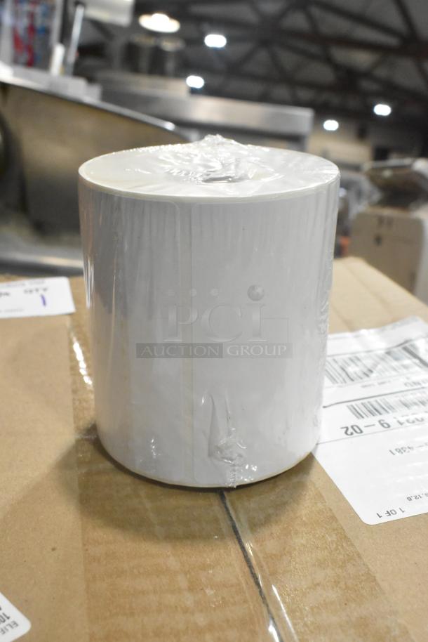 Brand new thermal receipt printer roll, wrapped in plastic, placed on a cardboard box. Suitable for retail use.