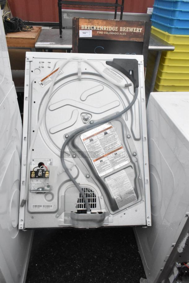Whirlpool metal front load dryer back view; 125/250 volts labels visible, gray finish, wiring connections shown, good condition.