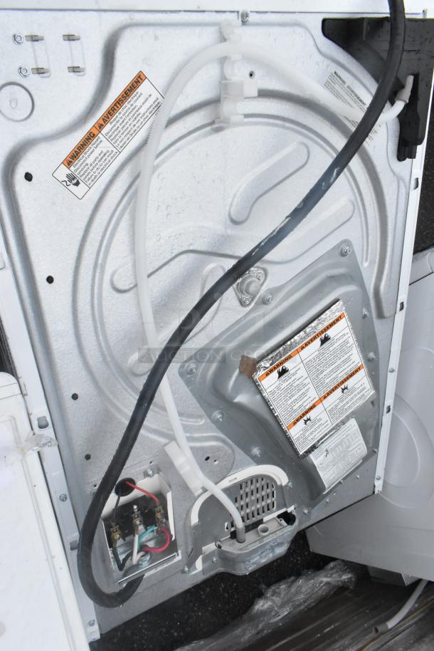 Whirlpool front load dryer, metal construction, 125/250 volts. Visible warning labels and wiring details. Used condition.