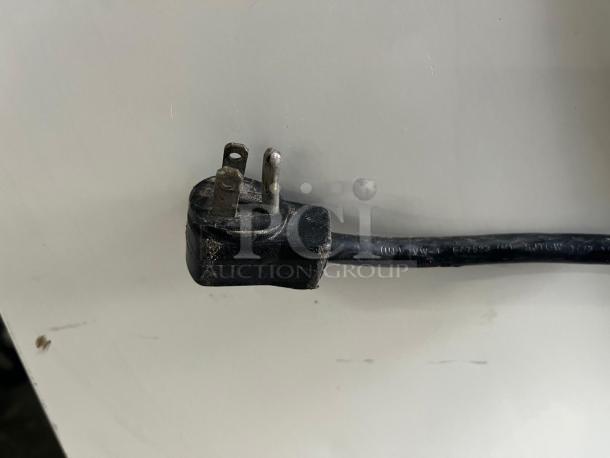 Damaged power plug from a Grab & Go Open Top Display Cooler, indicative of required repair for functionality.