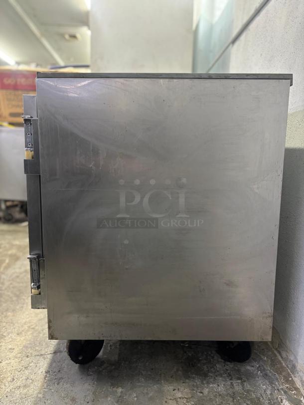 Beverage-Air 27" undercounter refrigerator, stainless steel, single door, on casters, 115v, visible wear.